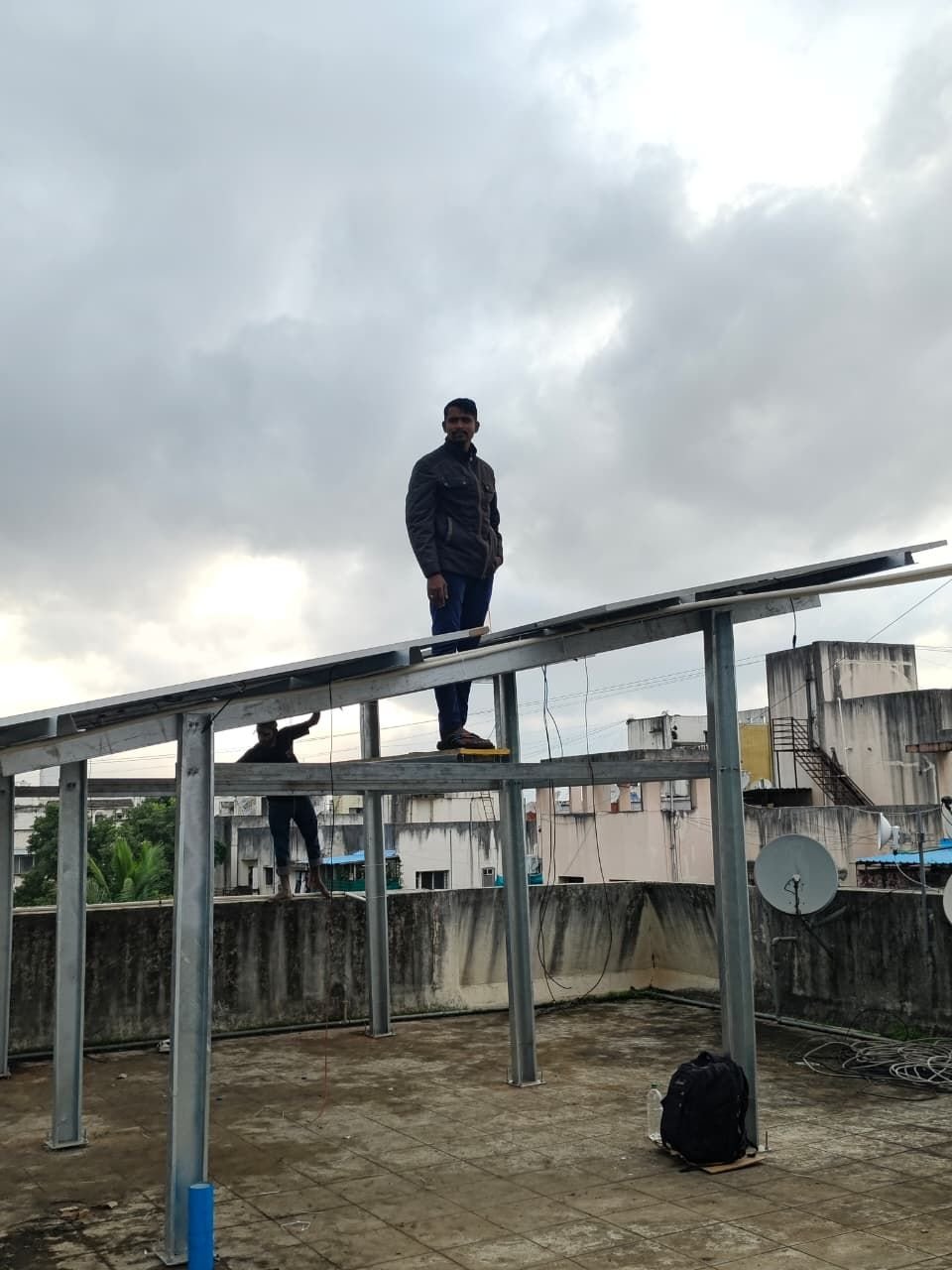 NovaRays technician on the mounting structure during installation